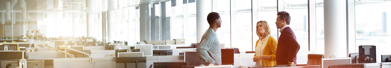 three people working in office
