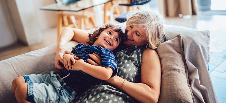 Grandma and Grandson laying on couch