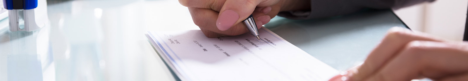 man writing a check